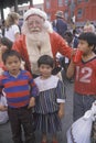 Santa Claus posing with homeless children Royalty Free Stock Photo