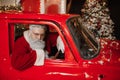 Santa Claus is preparing for Christmas. Portrait of an angry Santa Claus driving. Aggressive driver, new year, christmas Royalty Free Stock Photo