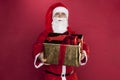 Santa Claus presents a gift Royalty Free Stock Photo