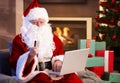 Santa Claus purchasing online Royalty Free Stock Photo