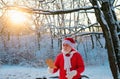 Santa Claus read wish list and walk in the snowy christmas woodland.