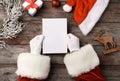 Santa Claus reading letter from child at table Royalty Free Stock Photo