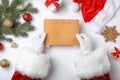 Santa Claus reading letter from child at table top view. Christmas celebration Royalty Free Stock Photo