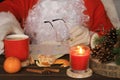 Santa Claus reading letter, drinking tea and eating tangerines. Royalty Free Stock Photo