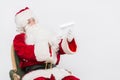 Santa Claus Reading Letter isolated over white baclground Royalty Free Stock Photo