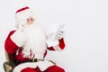 Santa Claus Reading Letter isolated over white baclground Royalty Free Stock Photo