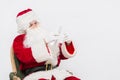 Santa Claus Reading Letter isolated over white baclground Royalty Free Stock Photo