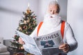 Santa claus reading newspaper Royalty Free Stock Photo