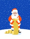 Santa Claus reads Naughty or Nice Kids List Royalty Free Stock Photo