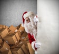 Santa Claus ready to deliver a lot of Christmas presents package Royalty Free Stock Photo