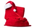 Santa Claus red bag with hat and gift box packed in red cloth, isolated on white background. File contains a path to isolation Royalty Free Stock Photo