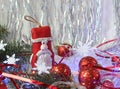 Santa Claus with red Christmas balloons and festive tinsel on a shiny background, close-up, space for text Royalty Free Stock Photo