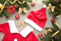 Santa Claus red hat and dress with decoration on grey background. Christmas decoration Royalty Free Stock Photo