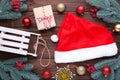 Santa Claus red hat and gifts on grey background. Christmas decoration Royalty Free Stock Photo