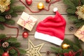 Santa Claus red hat and gifts on grey background. Christmas decoration Royalty Free Stock Photo