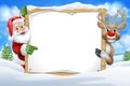 Santa Claus and Reindeer Christmas Snow Scene Sign Royalty Free Stock Photo