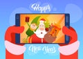 Santa Claus With Reindeer Elfs Making Selfie Photo, New Year Christmas Holiday Greeting Card Royalty Free Stock Photo