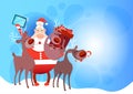 Santa Claus With Reindeer Making Selfie Photo, New Year Christmas Holiday Greeting Card Royalty Free Stock Photo