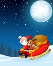 Santa claus and a reindeer riding his sleigh and carry huge sack in the night background Royalty Free Stock Photo