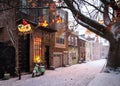 Santa Claus reindeer sleigh Christmas decorations hanging outside a Philadelphia rowhouse in Queen Village in the snow