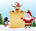 Santa claus with reindeer and snowman with blank sign in winter landscape