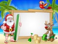 Santa Claus and Reindeer Surf Beach Christmas Sign Royalty Free Stock Photo