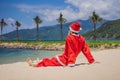 Santa Claus relaxing on sea beach - christmas or happy new year concept. Christmas in the tropics after quarantine was Royalty Free Stock Photo