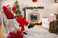 Santa claus relaxing on sofa in living room at home Royalty Free Stock Photo