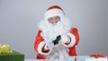 Santa Claus reloads the gun and aims at the camera 50 fps