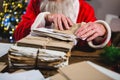 Santa Claus removing a letter