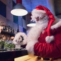 Santa Claus rests in bar with hot cappuccino