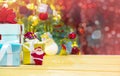 Santa Claus with ribbon christmas gift box set and decorated christmas tree on abstract bokeh glitter background Royalty Free Stock Photo