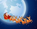 Santa Claus rides reindeer sleigh against a full moon background Royalty Free Stock Photo