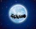 Santa Claus rides reindeer sleigh silhouette against a full moon background Royalty Free Stock Photo