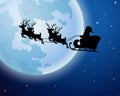 Santa Claus rides reindeer sleigh silhouette against a full moon background Royalty Free Stock Photo