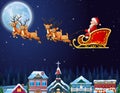 Santa Claus riding his reindeer sleigh flying over town Royalty Free Stock Photo