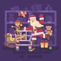 Santa Claus riding a shopping cart with his elf in a supermarket Royalty Free Stock Photo