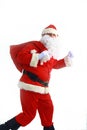 Santa Claus running with the bag of the presents Royalty Free Stock Photo