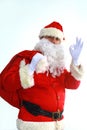 Santa Claus running with the bag of the presents Royalty Free Stock Photo