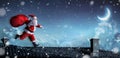 Santa Claus Running On The Rooftops Royalty Free Stock Photo