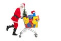 Santa Claus running with shopping cart Royalty Free Stock Photo