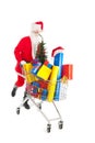 Santa Claus running with shopping cart Royalty Free Stock Photo