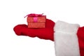 Santa Claus`s hand holding a red box with a ribbon. Christmas gift concept. Isolated on white background Royalty Free Stock Photo