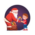Santa Claus gives wrapped gift box to cute boy kid Royalty Free Stock Photo