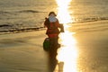 Santa Claus on sea sunset beach. Happy New Year and merry Christmas travel, tropical vacations concept. Royalty Free Stock Photo