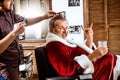 Santa claus shaving his personal barber Royalty Free Stock Photo