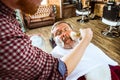 Santa claus shaving his personal barber Royalty Free Stock Photo