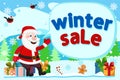 Santa Claus sits on gift boxes and shows his hand on the inscription. Winter sales. Royalty Free Stock Photo