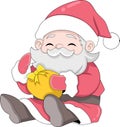 Santa Claus sits with a happy face and brings Christmas gifts to the children Royalty Free Stock Photo