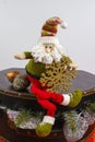 Santa Claus sits on vintage brouwn coffer with white christmas t